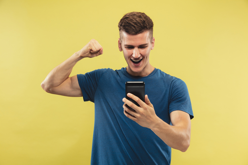 caucasian-young-man-s-half-length-portrait-yellow-studio-background-beautiful-male-model-blue-shirt-concept-human-emotions-facial-expression-sport-betting-online-purchases-sale.jpg